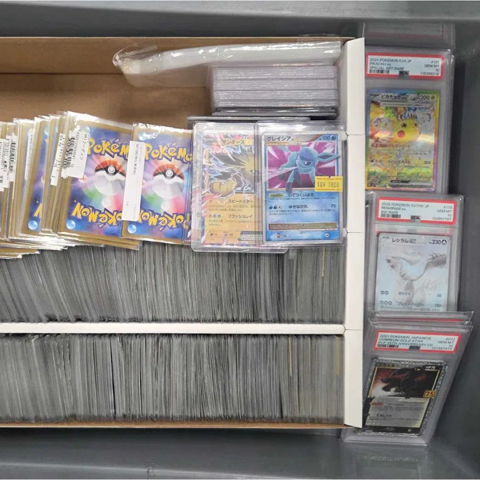 Pokemon trading cards worth more than $30,000 in total were found in the man's luggage. PHOTO: IMMIGRATIONS AND CHECKPOINTS AUTHORITY/FACEBOOK