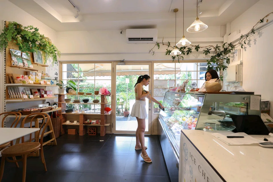 Ms Linda Lim, a sales staff member at Flor Patisserie, serving a customer who identified herself only as Dionna, at the bakery’s Siglap Drive outlet on May 16, 2025.