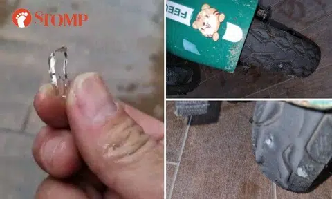 The tyres of a GrabFood rider's personal mobility aid (PMA) was damaged by pieces of broken glass and nails outside Wood Square mall in Woodlands on Monday morning (March 27).