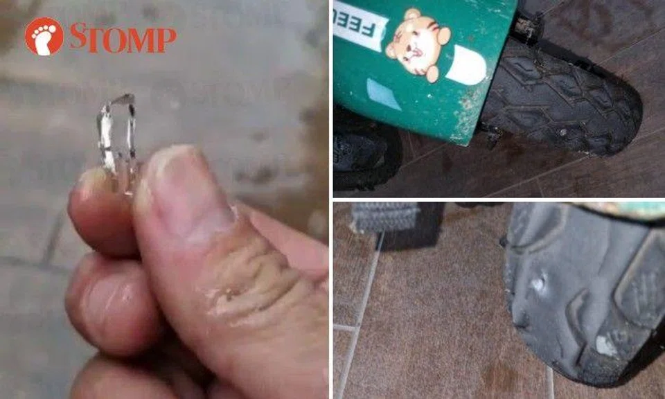 The tyres of a GrabFood rider's personal mobility aid (PMA) was damaged by pieces of broken glass and nails outside Wood Square mall in Woodlands on Monday morning (March 27).