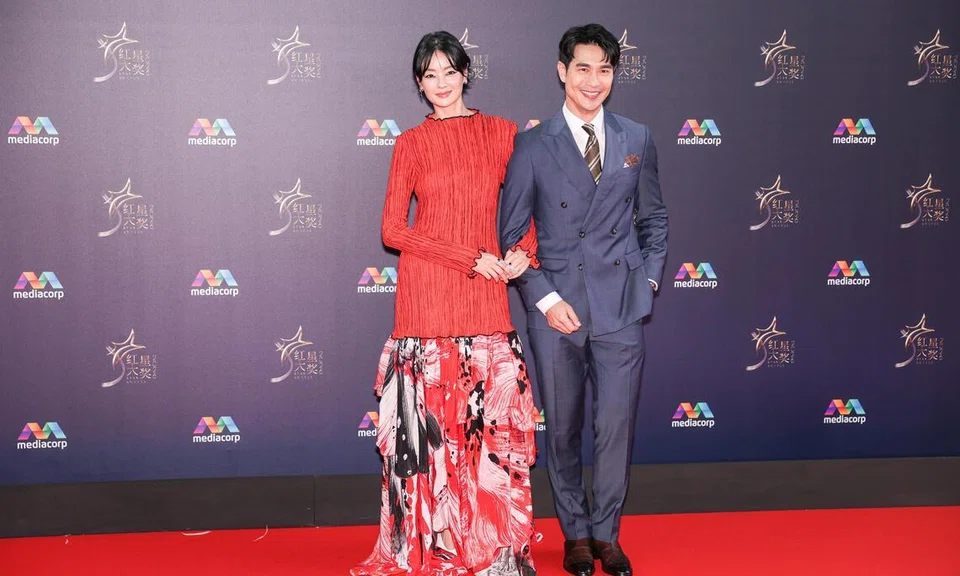 (From left) Actress Sheila Sim and actor Pierre Png on the red carpet at the Star Awards at Mediacorp on April 19. 