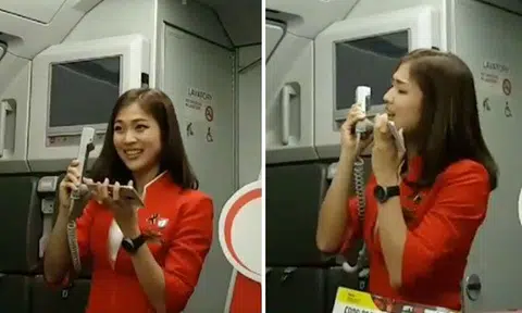 Cute Thai AirAsia stewardess's performance during flight delay is the best inflight entertainment you'll see today