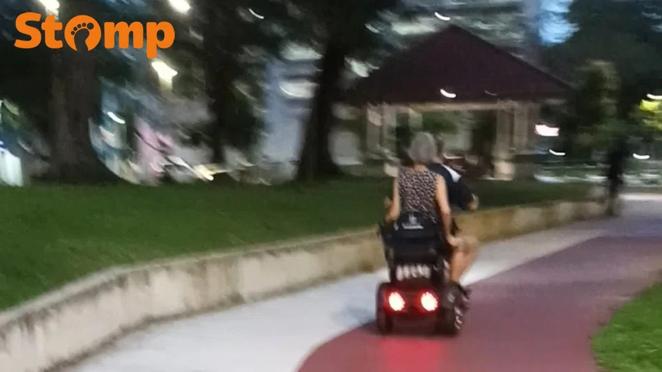 Elderly couple on a device at Choa Chu Kang North 7.