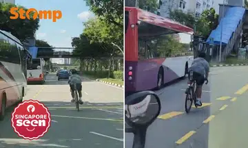 Boy rides bicycle without helmet and cuts into bus lane