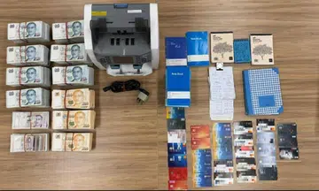 More than $314,000 in cash and 30 ATM cards were seized, among other items, during a raid of the operations.