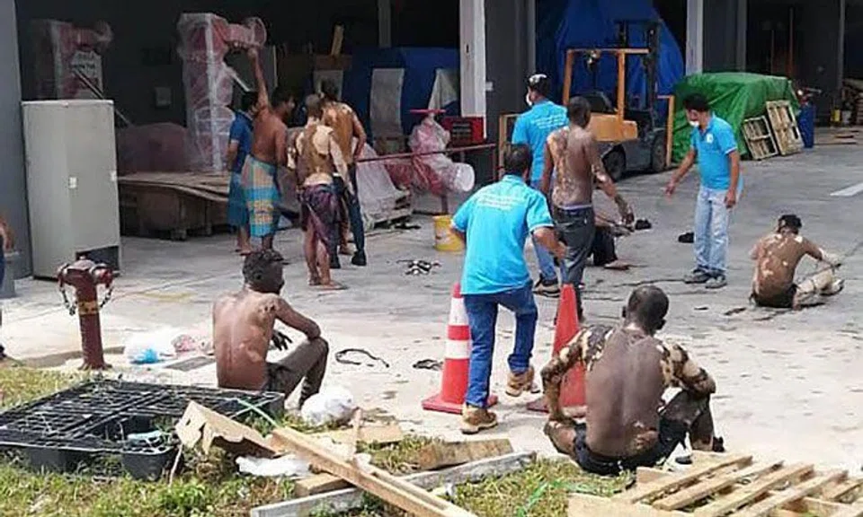 Victims gathered outside on the ground floor of the premises. PHOTO: LIANHE ZAOBAO
