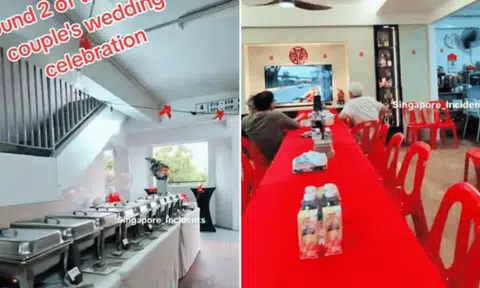 Couple host wedding buffet in HDB corridor