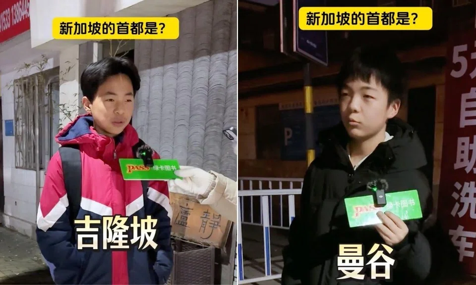 Boy on the left wearing red, blue and white jacket answering a question in the street interview, with Kuala Lumpur in Chinese written on lower half of the screen. Right half shows another student wearing a black coat and saying that Bangkok is the capital of Singapore.