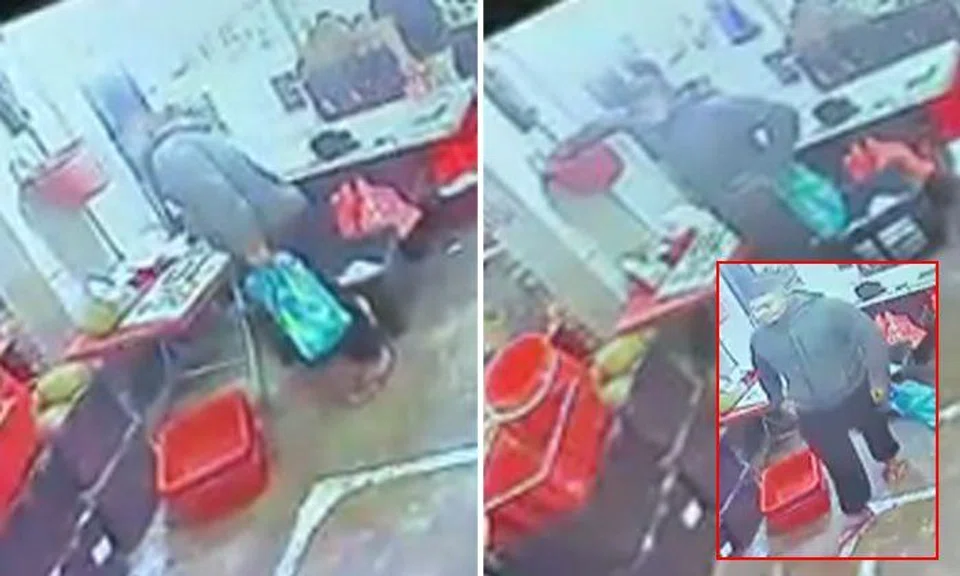 Customer takes stall owner's phone from table, then helps himself to cash in bucket