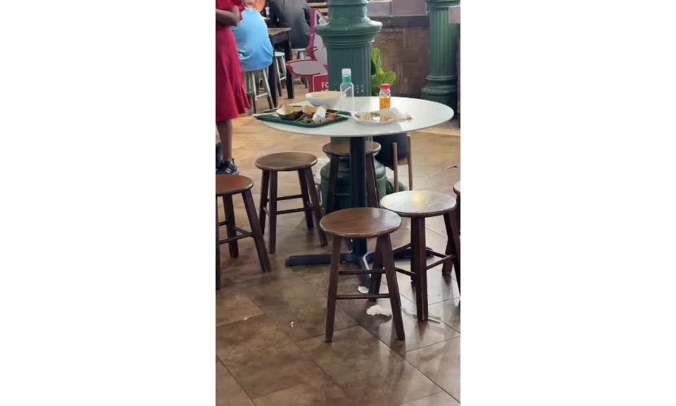 tourist dirty plates trays Lau Pa Sat tables