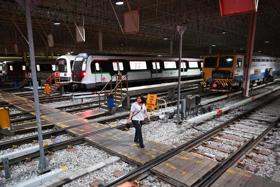 Train captain Munirah Zulkepli, 29, walking towards the train she is going to launch on the morning of March 11 from Bishan Depot.