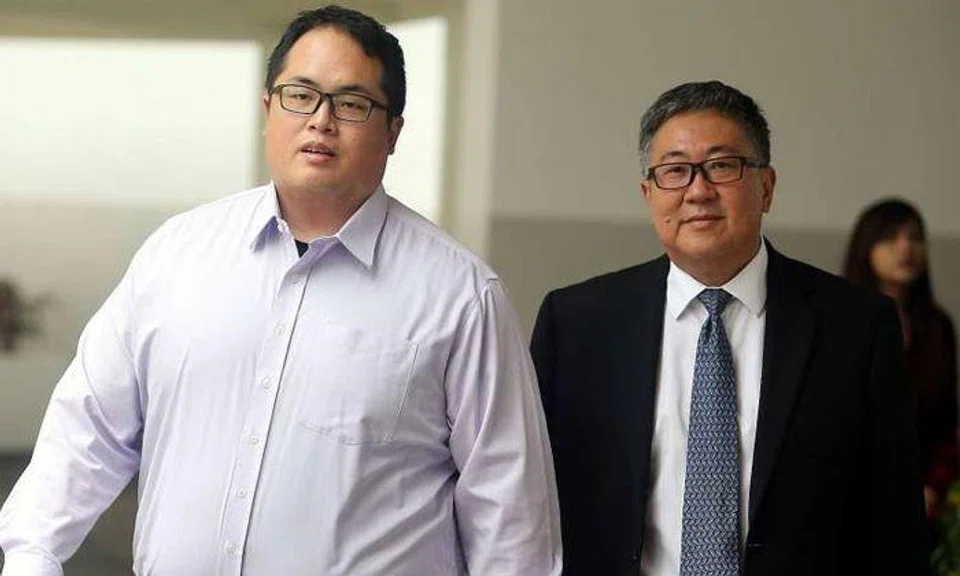 Jonathan Tan Huai En (left) and his father Senior Counsel Tan Chee Meng, leaving the State Courts on Feb 2, 2017. Photos: The Straits Times
