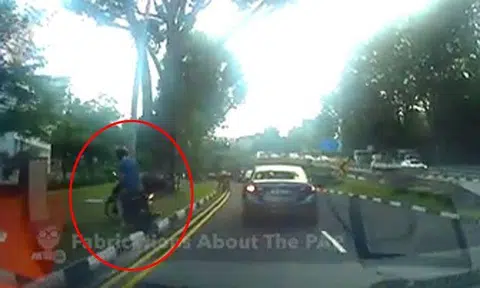 Motorcyclist mounts pavement just before ERP gantry, then goes back on road after he passes it