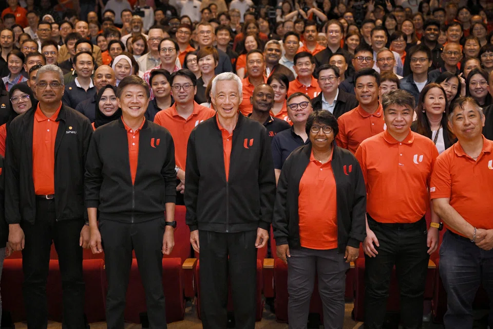 Senior Minister Lee Hsien Loong (centre), flanked by NTUC secretary-general Ng Chee Meng (second from left) and NTUC president K. Thanaletchimi, at a dialogue session with labour movement leaders and union leaders on April 14.
