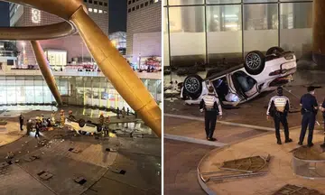 Photos of the Suntec City accident posted on social media show an overturned light-coloured car, with debris scattered in the vicinity.