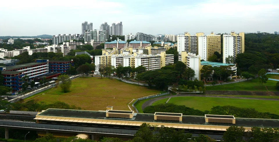Once the tallest HDB blocks in Singapore, the three 16-storey blocks (right) that gave Commonwealth estate its colloquial name, Chap Lak Lau, are now dwarfed by the city skyline in the distance. On the left, in white, blue and red, is Singapore’s first flatted factory.