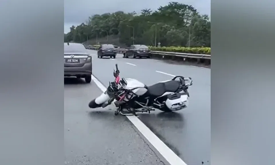 The motorcycle the man was riding left on the road after the accident on the highway in Johor.