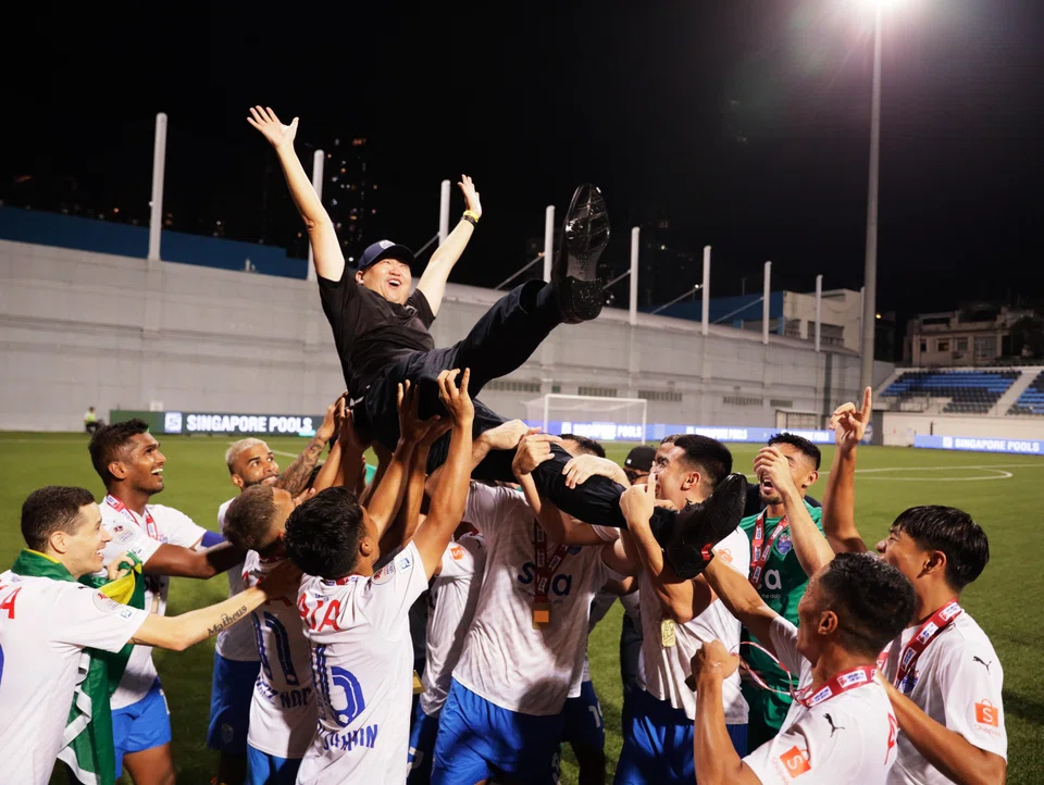 Forrest Li being lifted by the Lion City Sailors players after they won the Singapore Cup by defeating Hougang United 3-1 on Dec 9, 2023.