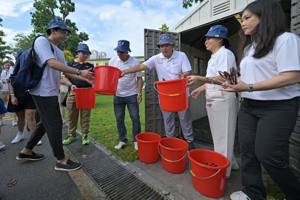 Newly-elected Bishan-Toa Payoh MP Elysa Chen (second from right) handing out tools and equipment to volunteers on May 11.