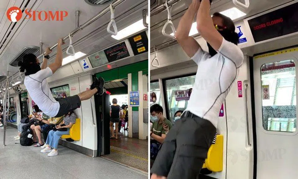 Commuter stunned by man doing pull-ups on train
