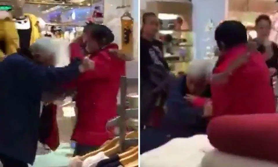 Woman repeatedly slaps elderly man and yells at him in shopping mall