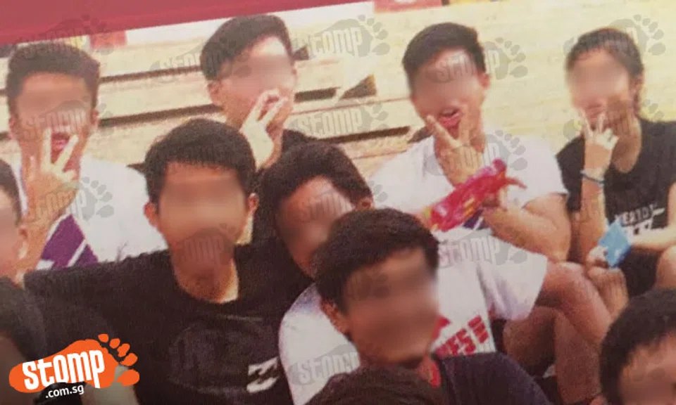 Why does this school magazine have a photo of students flashing obscene ...
