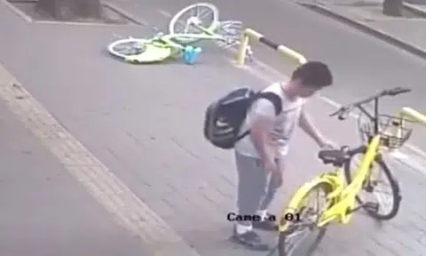 While some Singaporeans are destroying bikes, this boy in China is saving them