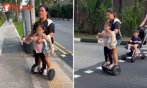Is this safe? Woman rides hoverboard with young girl at Newton pedestrian crossing