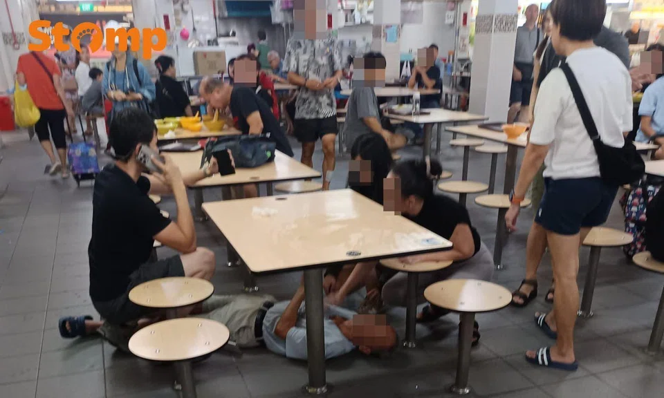 Man collapses under table, appears to bleed from left ear.