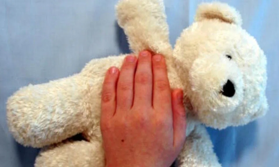 Man charged with molesting his 9-year-old son while boy was asleep