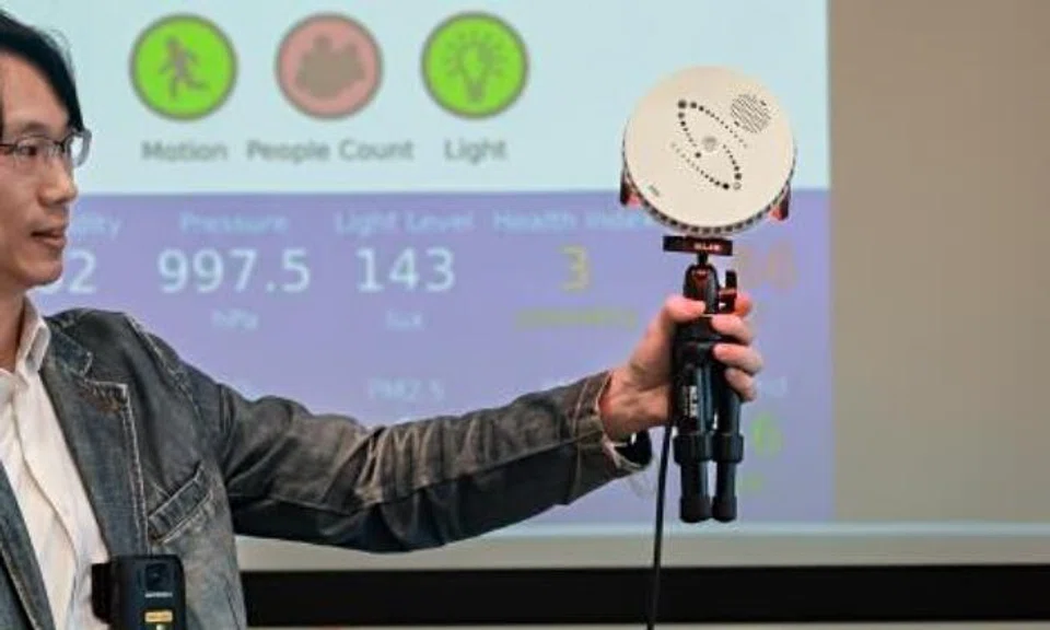 Mr Choong Kit Soon, pre-sales lead of Motorola Solutions Singapore, holding a Halo Smart Sensor in 2024.