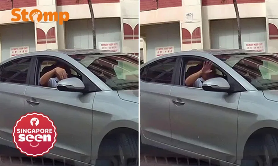 Driver gestures at Stomper to go away so he can complete right turn in Tampines