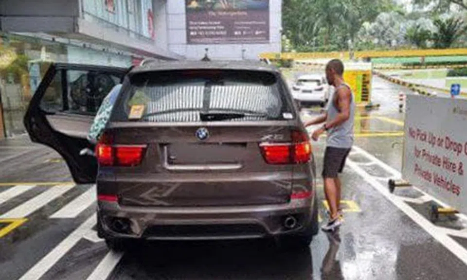 The driver of the BMW X5 allegedly shoved the security officer to the ground, causing the man to fracture his palm and injure his lower back. PHOTO: UNION OF SECURITY EMPLOYEES