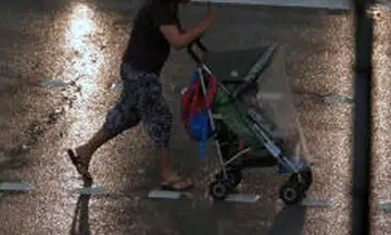 woman pushing stroller