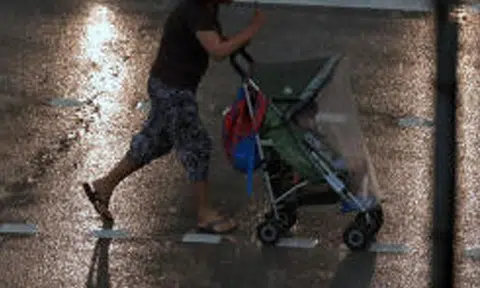 woman pushing stroller