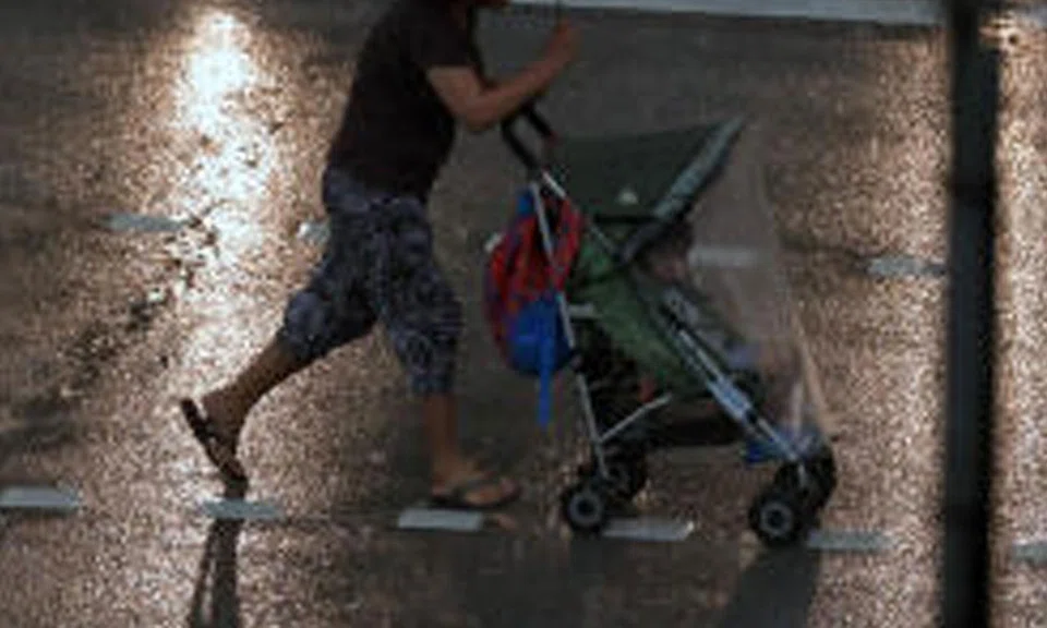 woman pushing stroller