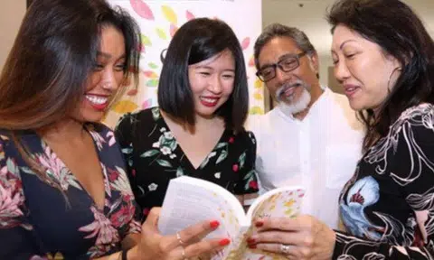 Mr Pragash’s sister (leftmost), mother (rightmost) and father (2nd from right) were also present at the launch of 'Stay Gold', a biography of their son written by Ms Clara Lock (2nd from left). PHOTO: LIANHE WANBAO