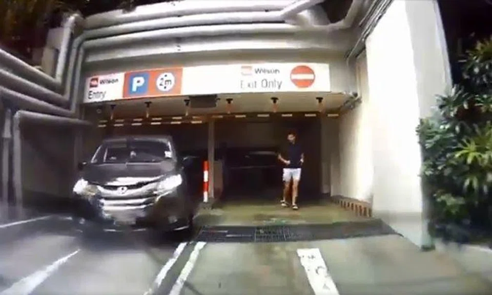 The driver exited the carpark via the entrance with the help of a passenger PHOTO: ALVIN LIM/FACEBOOK