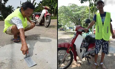 57-year-old Malaysian retiree patrols village daily and fixes potholes -- with all expenses out of his own pockets