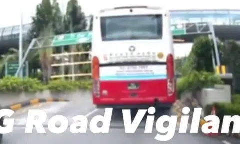 A dashcam video posted online by SG Road Vigilante shows the top of the vehicle hitting the structure and forcing it down. 