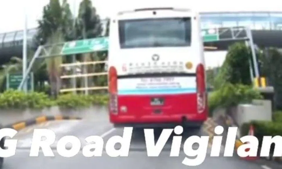 A dashcam video posted online by SG Road Vigilante shows the top of the vehicle hitting the structure and forcing it down. 