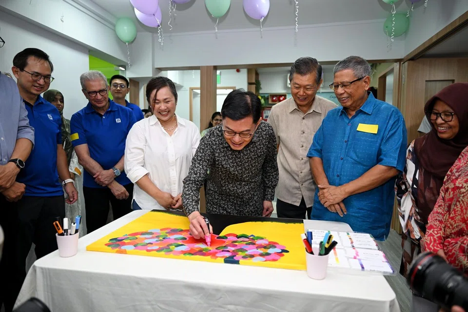 Deputy Prime Minister Heng Swee Keat taking part in an art activity at the official opening of Casa Raudha headquarters in Bedok on Feb 22.