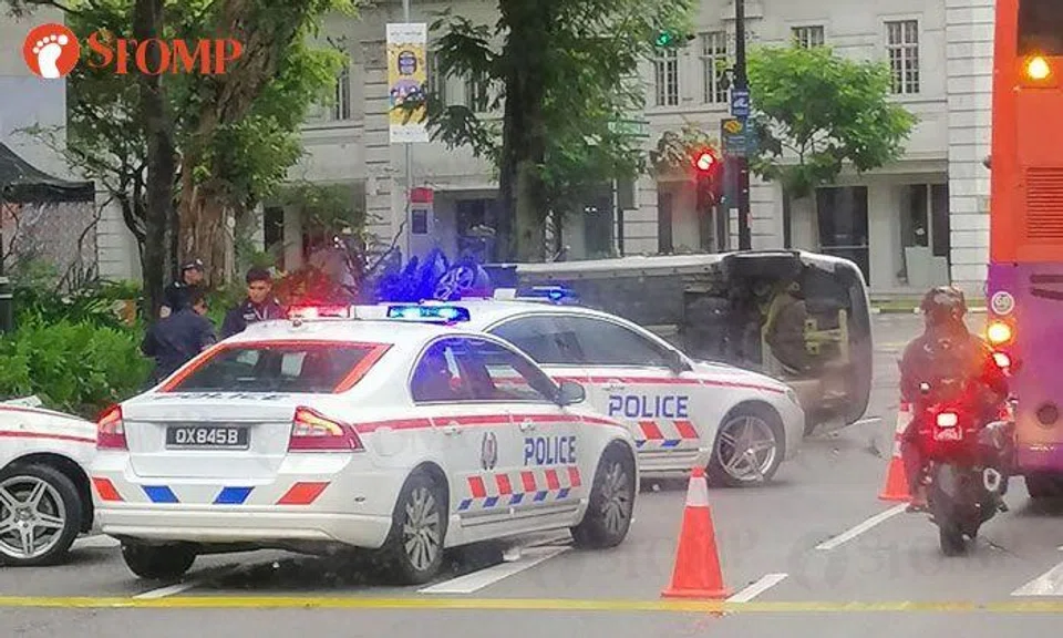 Driver, 21, arrested for drink-driving after car flips over along Bras Basah Road, 3 taken to hospital