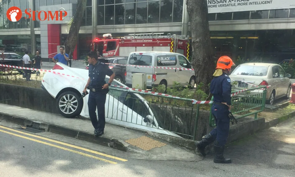 67-year-old woman sent to NUH after car crashes into drain along Bukit ...