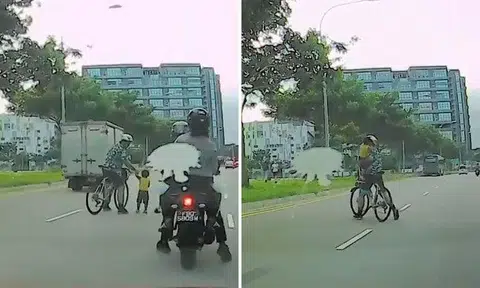 Cyclist saves young child riding scooter in middle of Yishun road from oncoming traffic