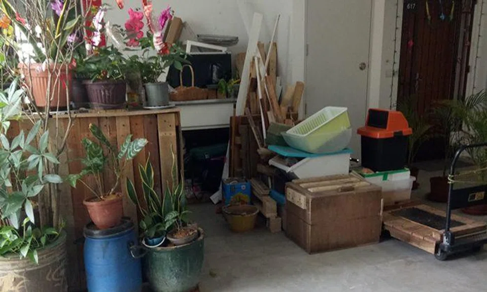 Town council engaging with Canberra resident who cluttered corridor with plants, planks and more