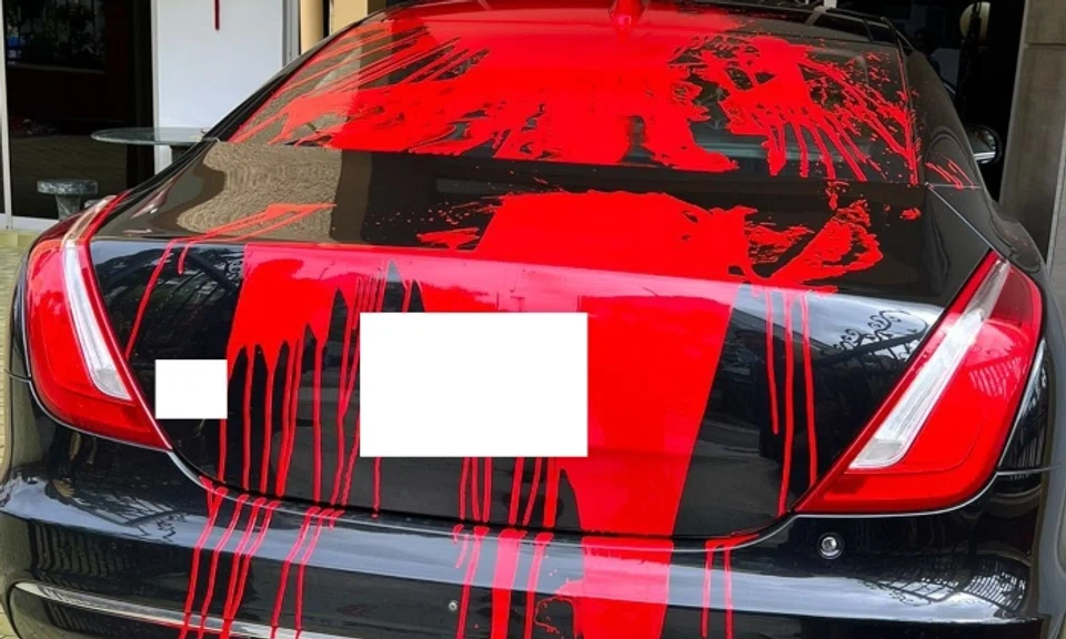 A car was splashed with red paint and a debtor’s note was placed on the car window at Lorong M Telok Kurau. Photo: Singapore Police Force