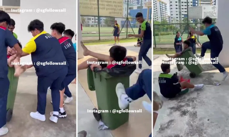 Boy ends up in trash bin that schoolmates kick until it rolls away and topples over as they laugh
