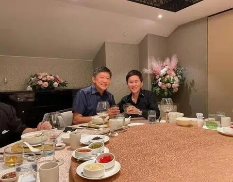 A picture showing labour chief Ng Chee Meng (left) posing with Fujian gang member Su Haijin has been circulated online.