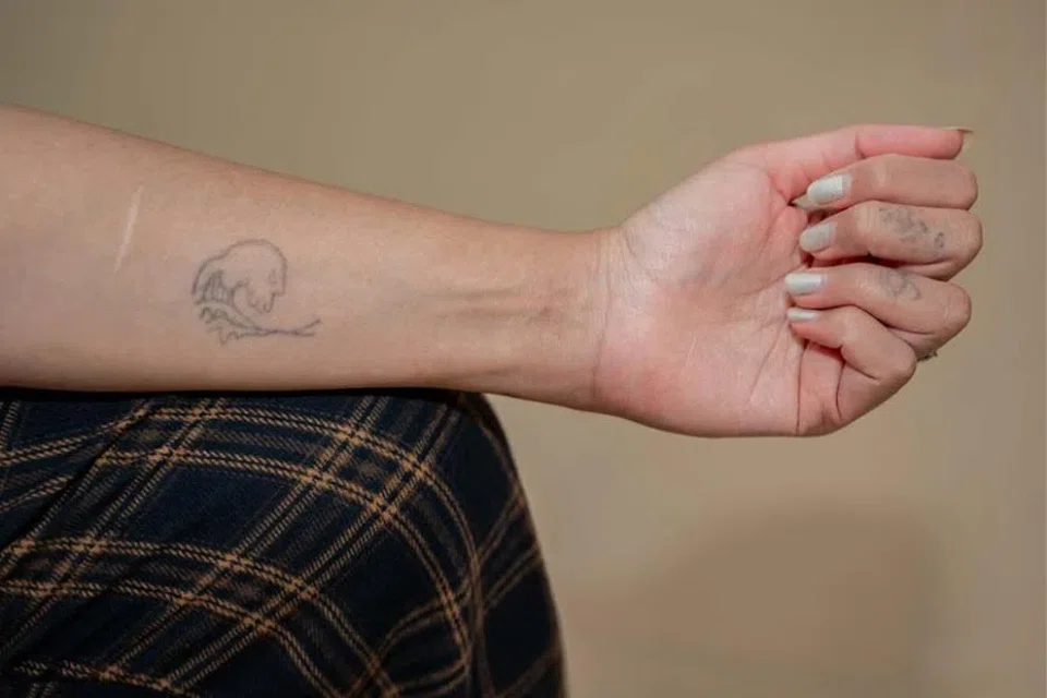 Ms Lea used a tattoo machine purchased online to ink The Great Wave Off Kanagawa onto her own arm.
